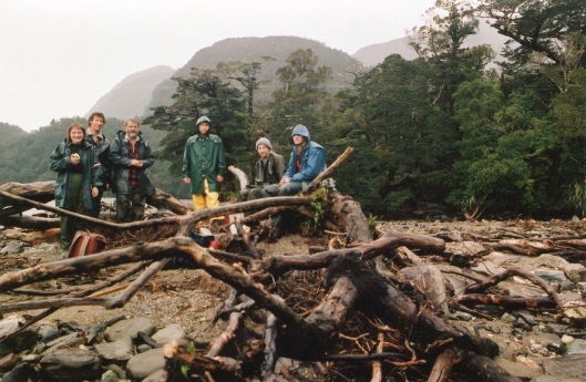 A damp party of botanists emerges from sampling forest on Secretary Island, Fiordland, c.1995. From left - Kath Dickinson, Brent Fagan, Alan Mark, Steven Roxburgh, Brent Kelley, Warren King. Photograph courtesy of the Department of Botany.