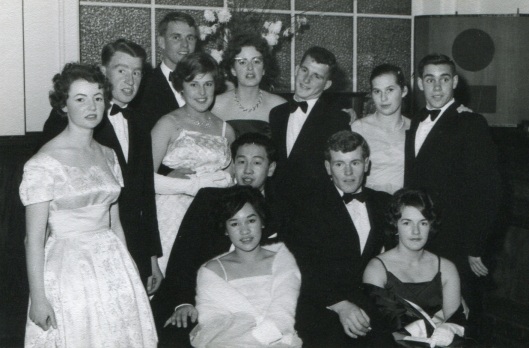 Jocelyn Wong, an arts student from Masterton, and Peter Chin, a law student from Dunedin, are at centre front of this group of students at a St Margaret's College ball in the early 1960s. Image courtesy of Peter Chin.