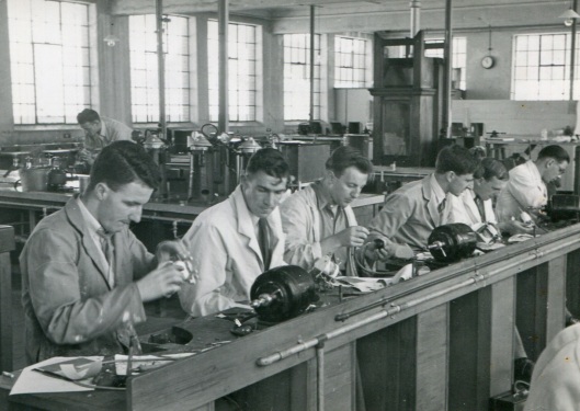 Dental students working in the prosthetics lab in 1949. Before reaching this stage they had to overcome the hurdle of an intermediate year. From left: Brian Arkinstall, Jim Armour, Reece Baker, Clive Bayley, Arthur Beattie and Nick Bebich. Image courtesy of Elaine Donaldson.
