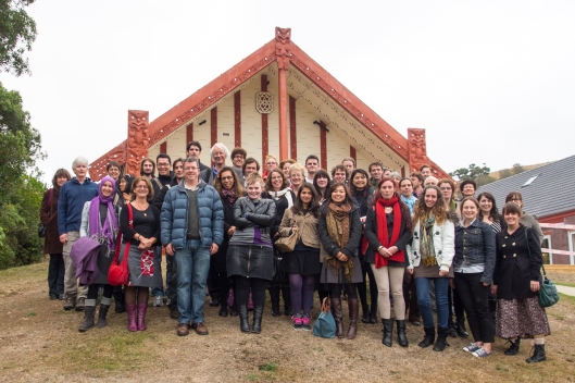 Staff and students of the National Centre for Peace and Conflict Studies (plus a few from tourism) at Otakou Marae in 2013. Foundation professor Kevin Clements is the tall figure with white hair in the middle. The centre began in 2009 as a Leading Thinkers initiative and quickly developed a great record of research, teaching and public engagement. By 2014 it had 6 academic staff and 24 PhD students from 19 countries. Image courtesy of the National Centre for Peace and Conflict Studies.